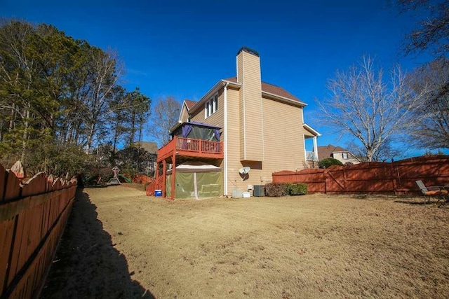 rear view of property with a yard