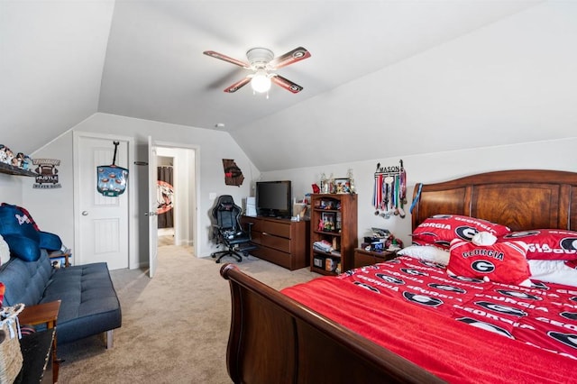 bedroom featuring light carpet, vaulted ceiling, and a ceiling fan