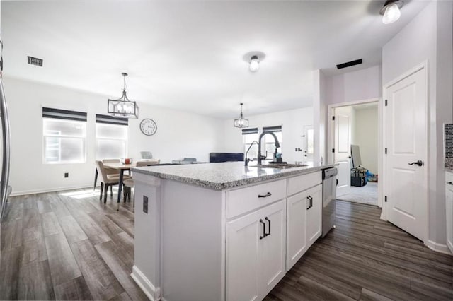 155 Knightsbridge Ln, Winder, GA 30680 - kitchen with a sink, a chandelier, stainless steel dishwasher, and dark wood-style flooring