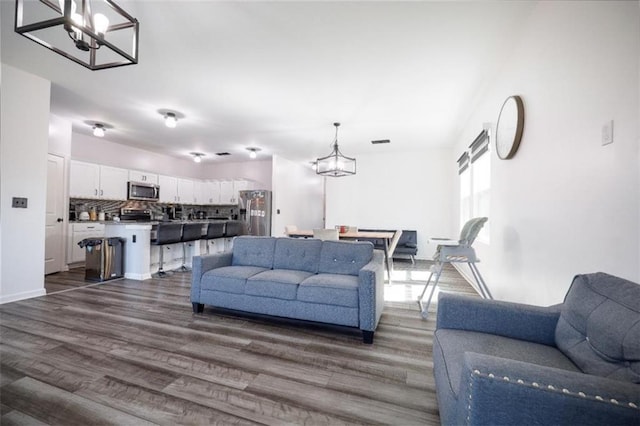 155 Knightsbridge Ln, Winder, GA 30680 - living area with a chandelier and dark wood-type flooring