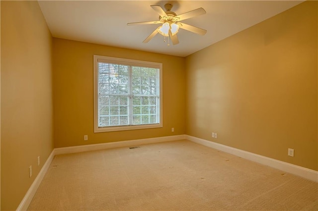 unfurnished room featuring carpet flooring and ceiling fan