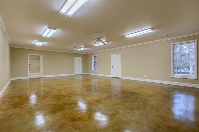 spare room featuring crown molding and concrete floors