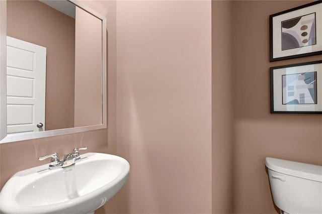 1315 Aura Ln, Lawrenceville, GA 30045 - half bathroom featuring a sink and toilet