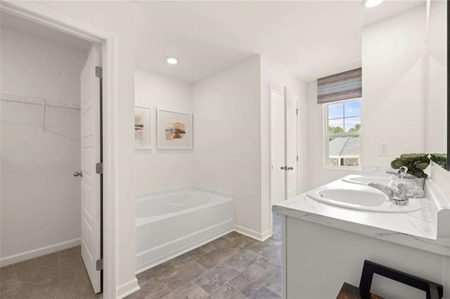 1315 Aura Ln, Lawrenceville, GA 30045 - full bathroom with a bath, double vanity, a spacious closet, and recessed lighting