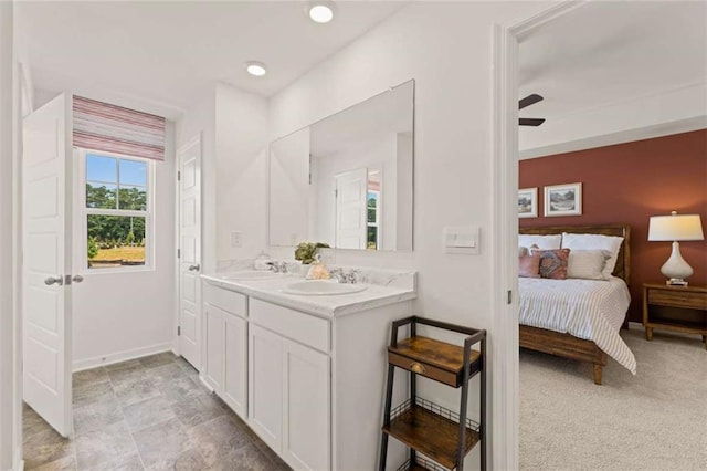 1315 Aura Ln, Lawrenceville, GA 30045 - ensuite bathroom featuring double vanity and baseboards