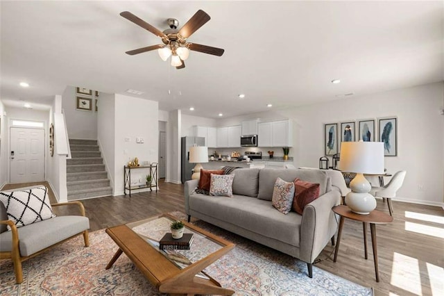 1315 Aura Ln, Lawrenceville, GA 30045 - living room with light wood-style floors, ceiling fan, stairway, and recessed lighting