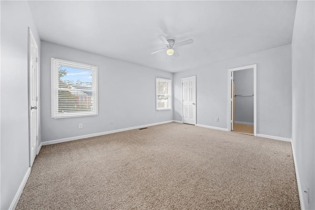 unfurnished bedroom with carpet floors and ceiling fan