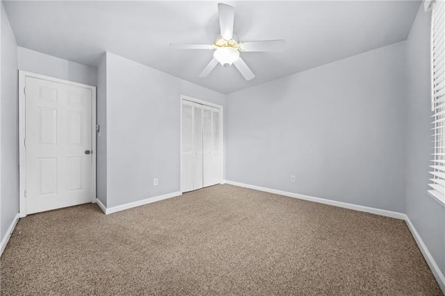 unfurnished bedroom with carpet floors, a closet, and ceiling fan