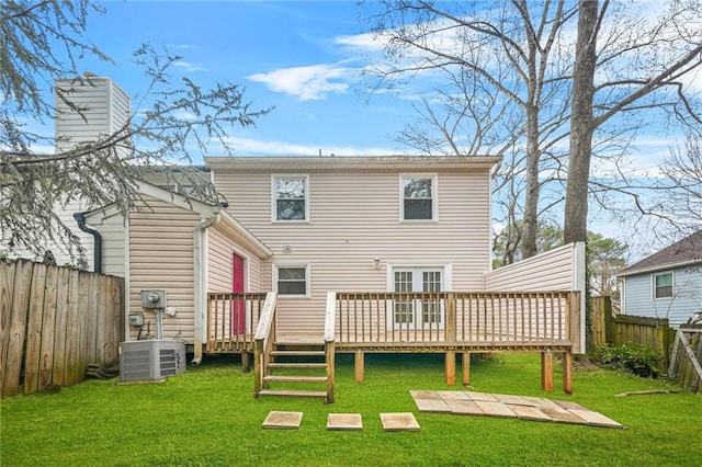 back of property featuring a yard, central AC, and a deck