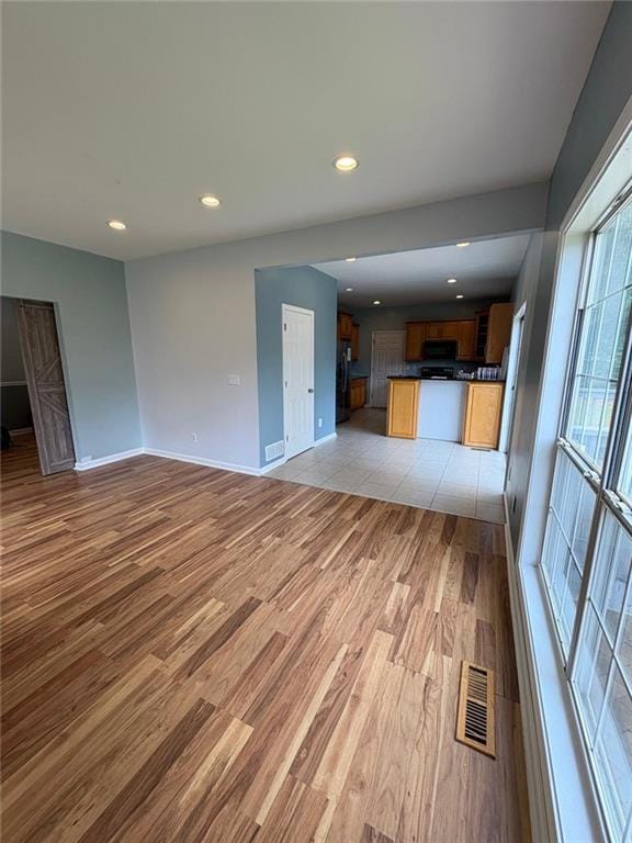 1951 Bergerac Ct SW, Marietta, GA 30008 - unfurnished living room featuring light wood finished floors, baseboards, and recessed lighting