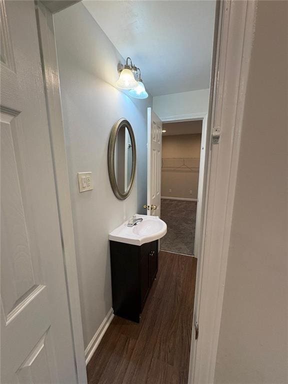 1951 Bergerac Ct SW, Marietta, GA 30008 - bathroom with vanity, wood finished floors, and baseboards