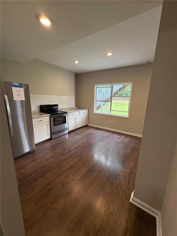 1951 Bergerac Ct SW, Marietta, GA 30008 - kitchen with stainless steel appliances, white cabinets, dark wood finished floors, decorative backsplash, and light stone counters