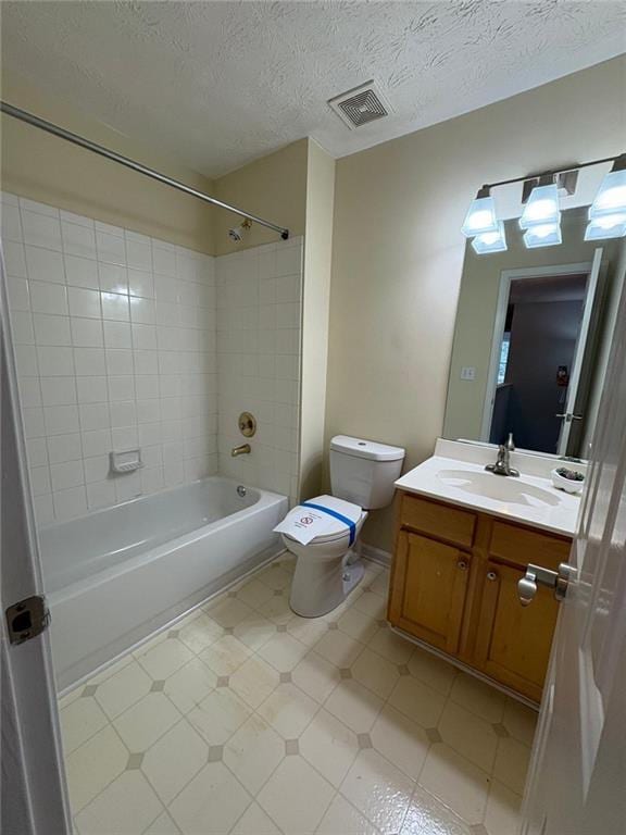 1951 Bergerac Ct SW, Marietta, GA 30008 - full bath with shower / bathtub combination, toilet, vanity, a textured ceiling, and tile patterned floors