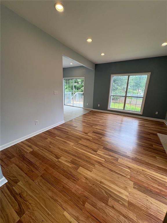 1951 Bergerac Ct SW, Marietta, GA 30008 - empty room featuring wood finished floors, recessed lighting, and baseboards