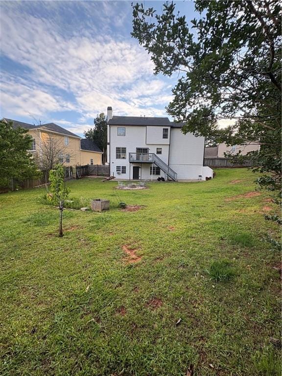 1951 Bergerac Ct SW, Marietta, GA 30008 - back of property with stairs, a chimney, and a wooden deck
