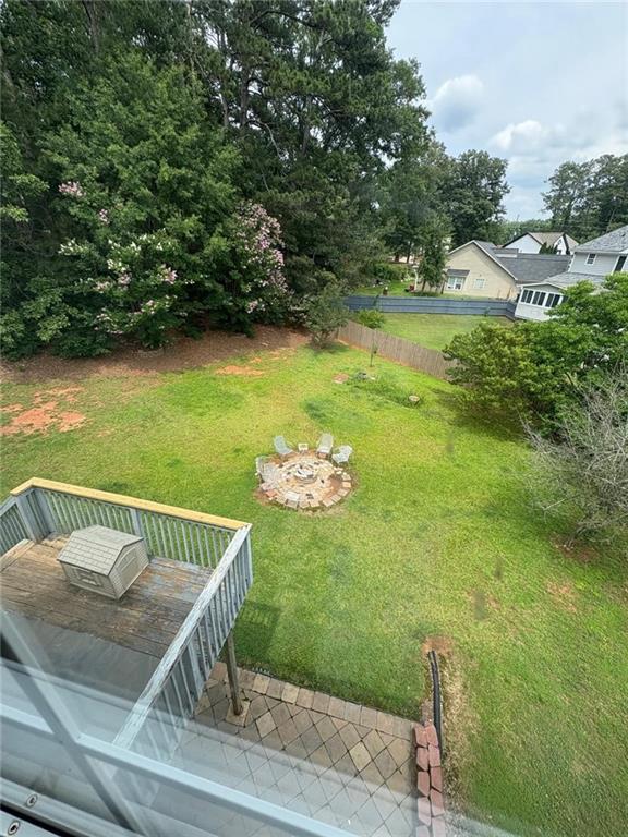 1951 Bergerac Ct SW, Marietta, GA 30008 - view of green lawn featuring a deck