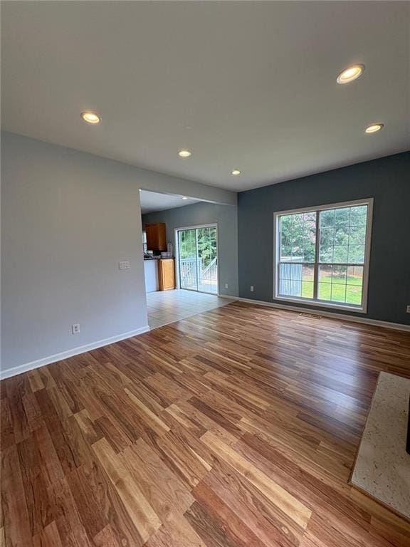 1951 Bergerac Ct SW, Marietta, GA 30008 - unfurnished living room with wood finished floors, recessed lighting, and baseboards