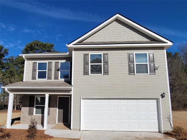 view of front of house featuring a garage and covered porch