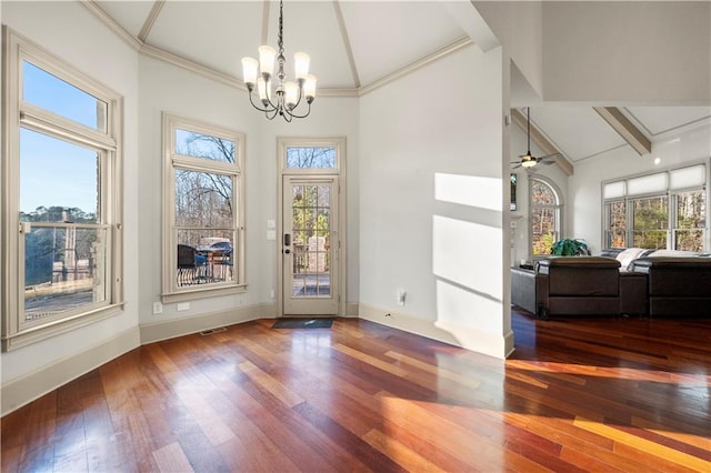 unfurnished dining area with baseboards, high vaulted ceiling, wood finished floors, and a healthy amount of sunlight