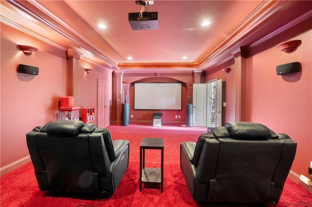 home theater featuring carpet floors, crown molding, and baseboards