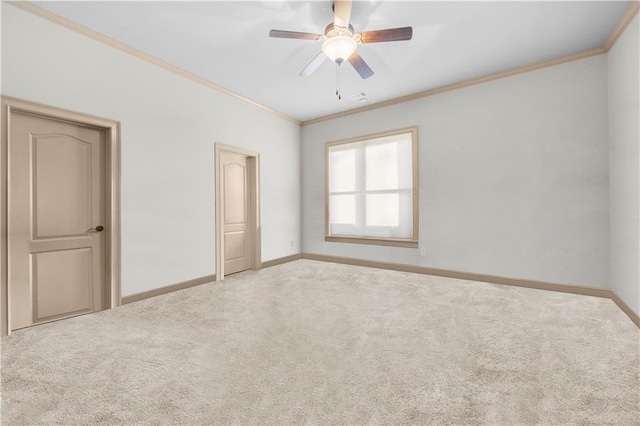 unfurnished bedroom with baseboards, carpet, and crown molding