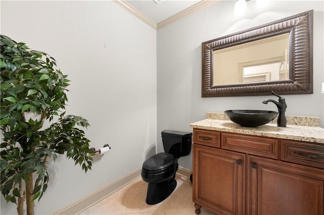 half bath with crown molding, toilet, vanity, baseboards, and tile patterned floors