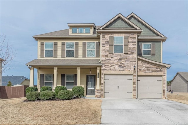 146 Blackgum Trce, Dallas, GA 30132 - craftsman inspired home with a garage, driveway, stone siding, and fence