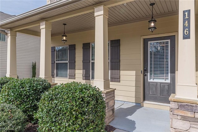 doorway to property featuring a porch