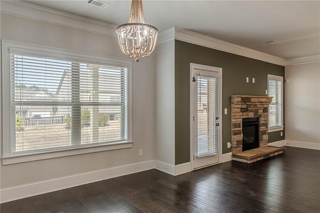 unfurnished living room with a chandelier, ornamental molding, a fireplace, and dark hardwood / wood-style flooring