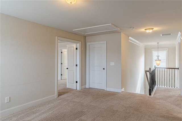 146 Blackgum Trce, Dallas, GA 30132 - carpeted empty room with attic access, baseboards, crown molding, and visible vents