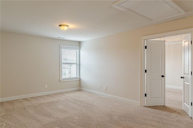 146 Blackgum Trce, Dallas, GA 30132 - unfurnished room with attic access, light carpet, and baseboards