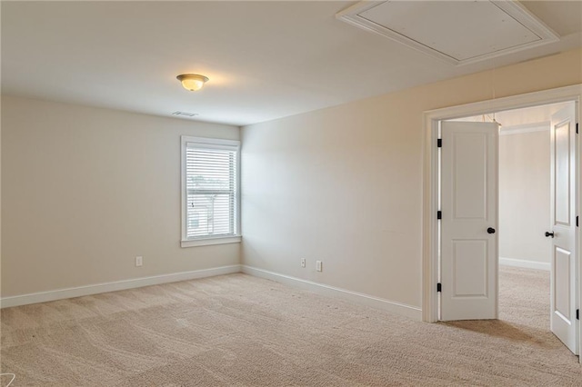 empty room with light colored carpet