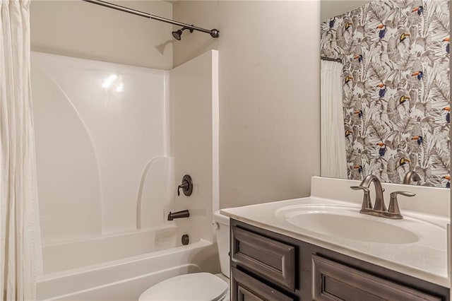 full bathroom featuring shower / bath combo, vanity, and toilet