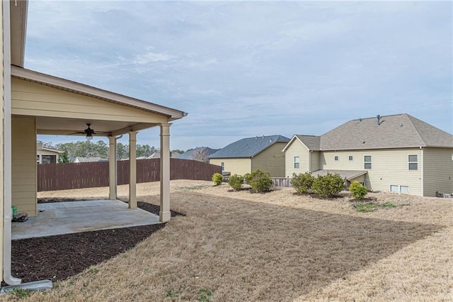 view of yard featuring ceiling fan and a patio area