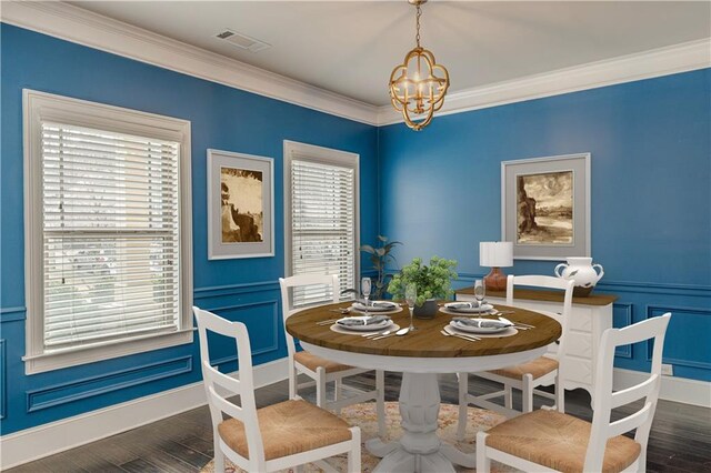 146 Blackgum Trce, Dallas, GA 30132 - dining area with a chandelier, wood finished floors, a healthy amount of sunlight, and crown molding