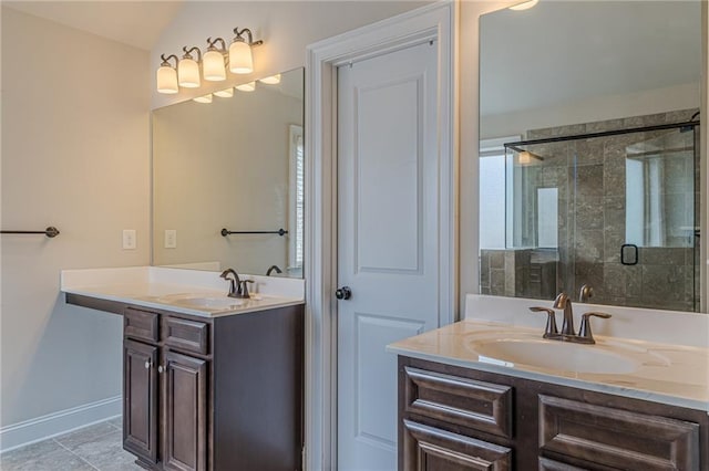 bathroom featuring vanity, an enclosed shower, and tile patterned floors