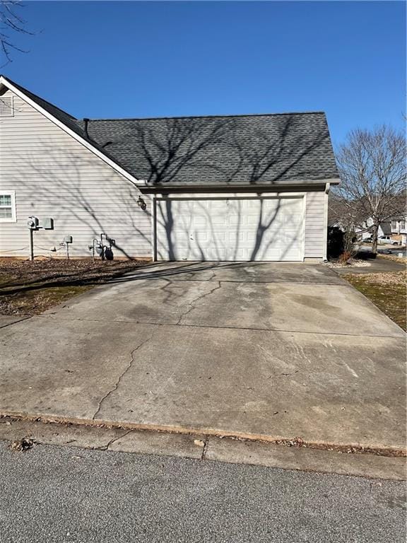 exterior space with concrete driveway