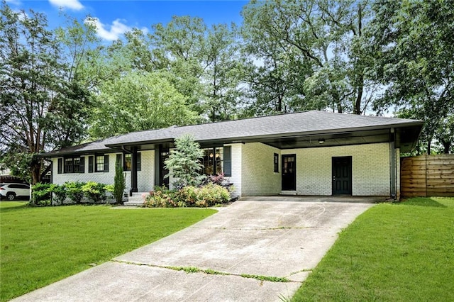 view of front of house with concrete driveway, brick siding, and an attached carport