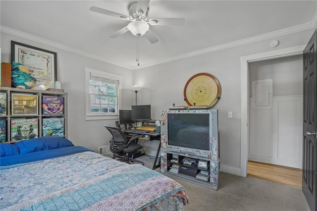 bedroom with crown molding, carpet flooring, baseboards, and a ceiling fan