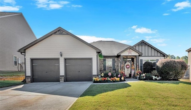 view of front facade with a front yard and a garage