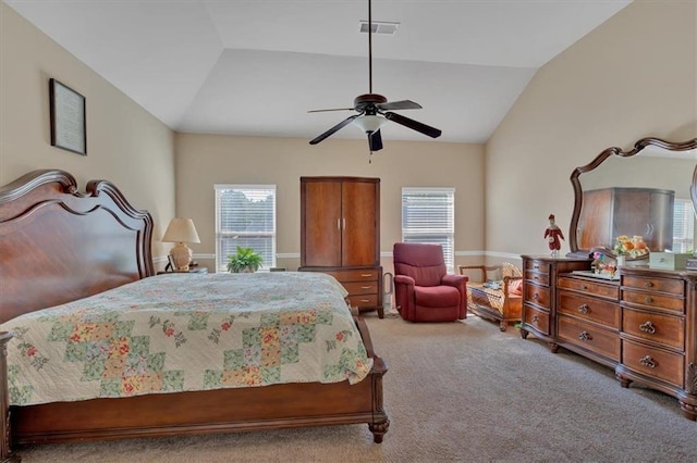 carpeted bedroom featuring ceiling fan and vaulted ceiling