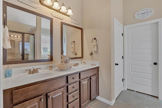 bathroom with vanity, an enclosed shower, and tile patterned flooring