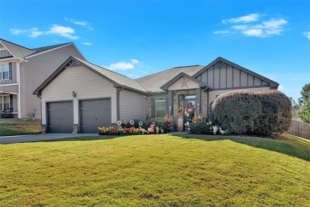 view of front of home with a front lawn and a garage