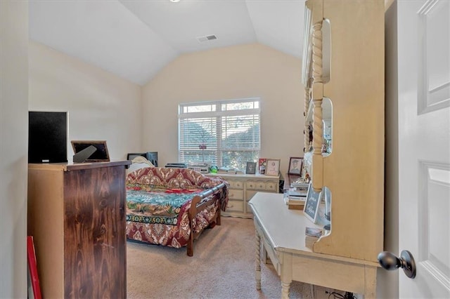 carpeted bedroom with vaulted ceiling