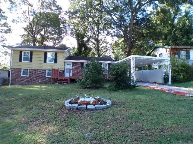 exterior space featuring a lawn and a carport