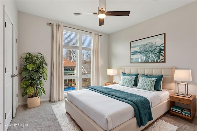 bedroom featuring ceiling fan and light colored carpet