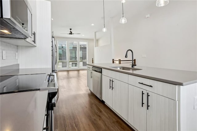 kitchen with ceiling fan, stainless steel appliances, pendant lighting, white cabinets, and sink