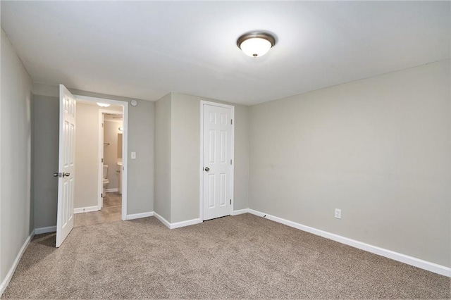 2434 Miriam Ln, Decatur, GA 30032 - unfurnished bedroom featuring carpet flooring, baseboards, and a closet