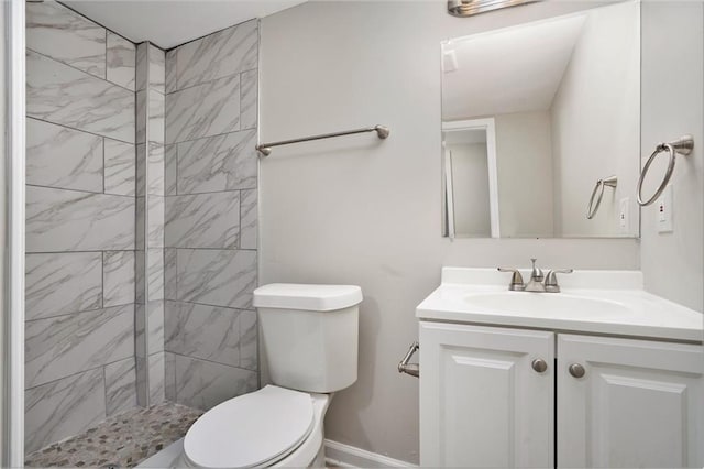2434 Miriam Ln, Decatur, GA 30032 - bathroom with toilet, baseboards, tiled shower, and vanity