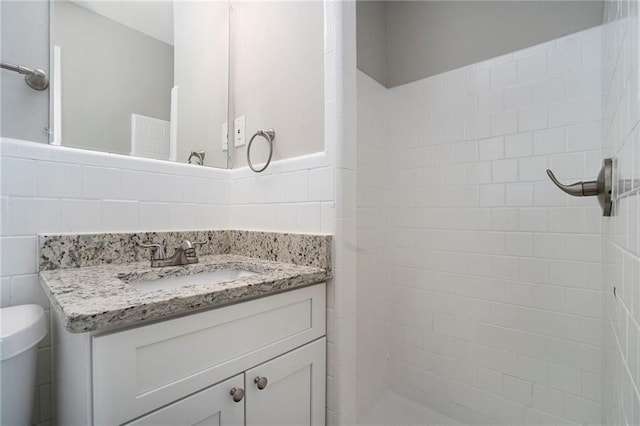 2434 Miriam Ln, Decatur, GA 30032 - full bath featuring vanity, a tile shower, toilet, and tile walls